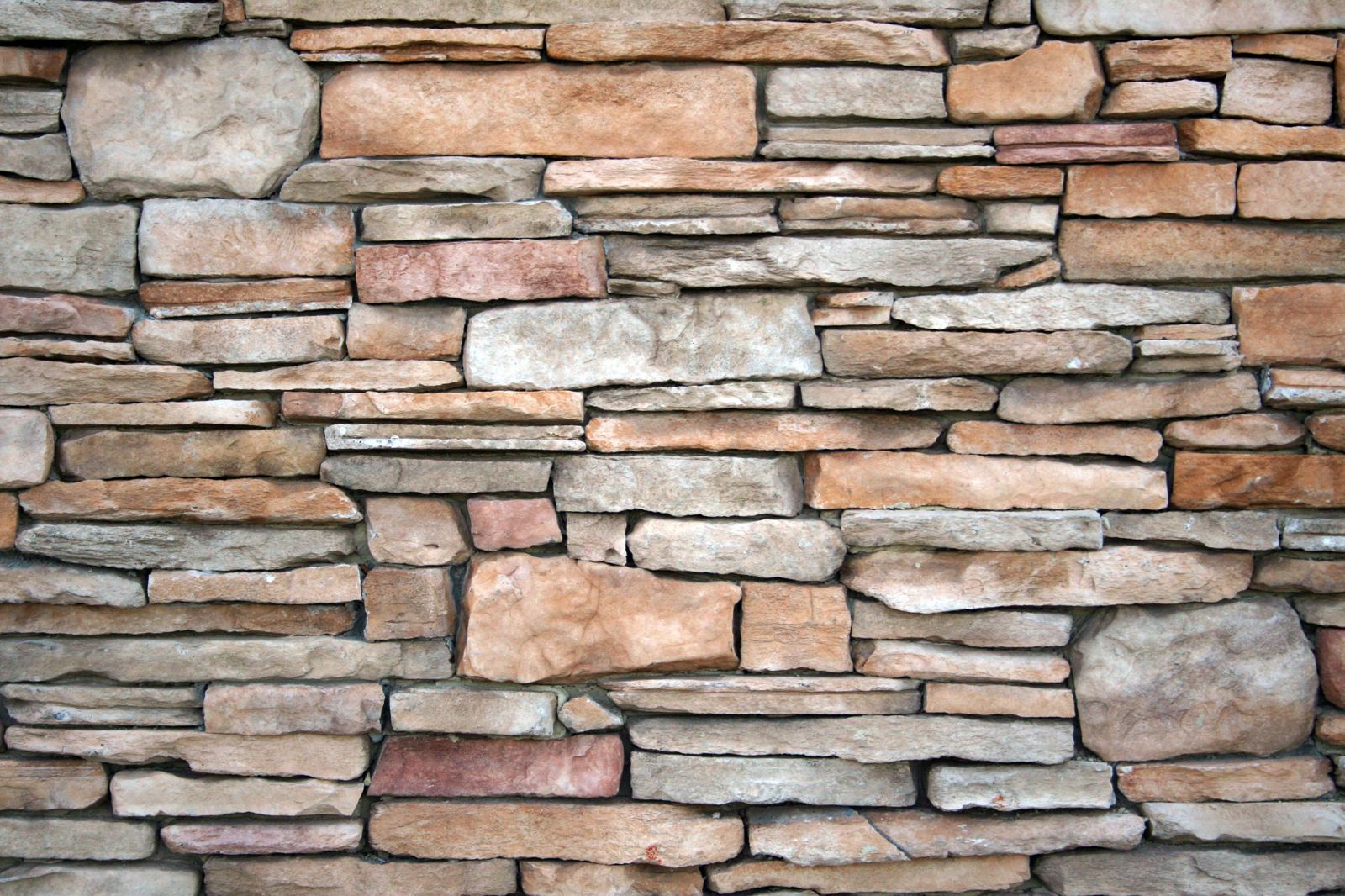 Close-up of a dry-stacked natural stone wall texture